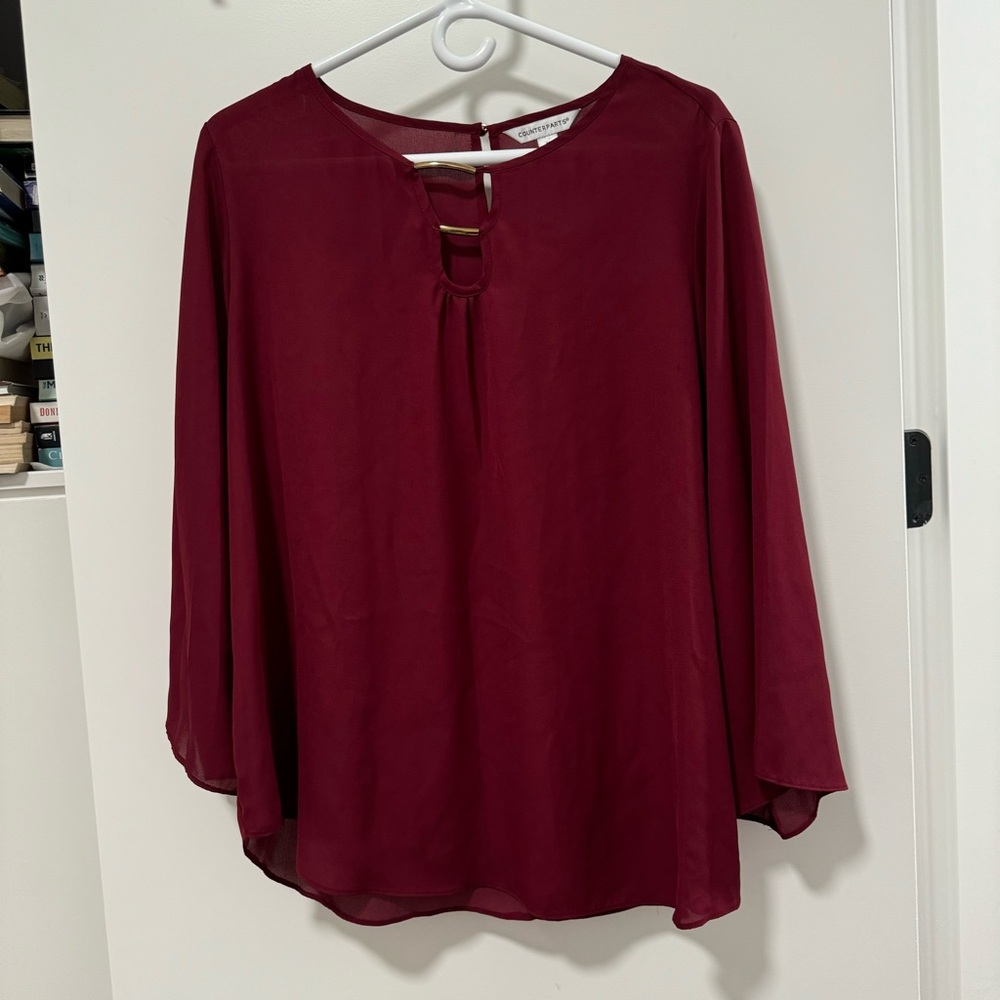 COUNTERPARTS in burgundy 3/4 bishop sleeve blouse.